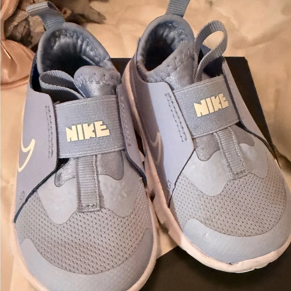 Nike Light Blue Slip-On Sneakers with White Swoosh